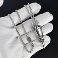 Chrome Hearts distressed cross rivet bullet pendant